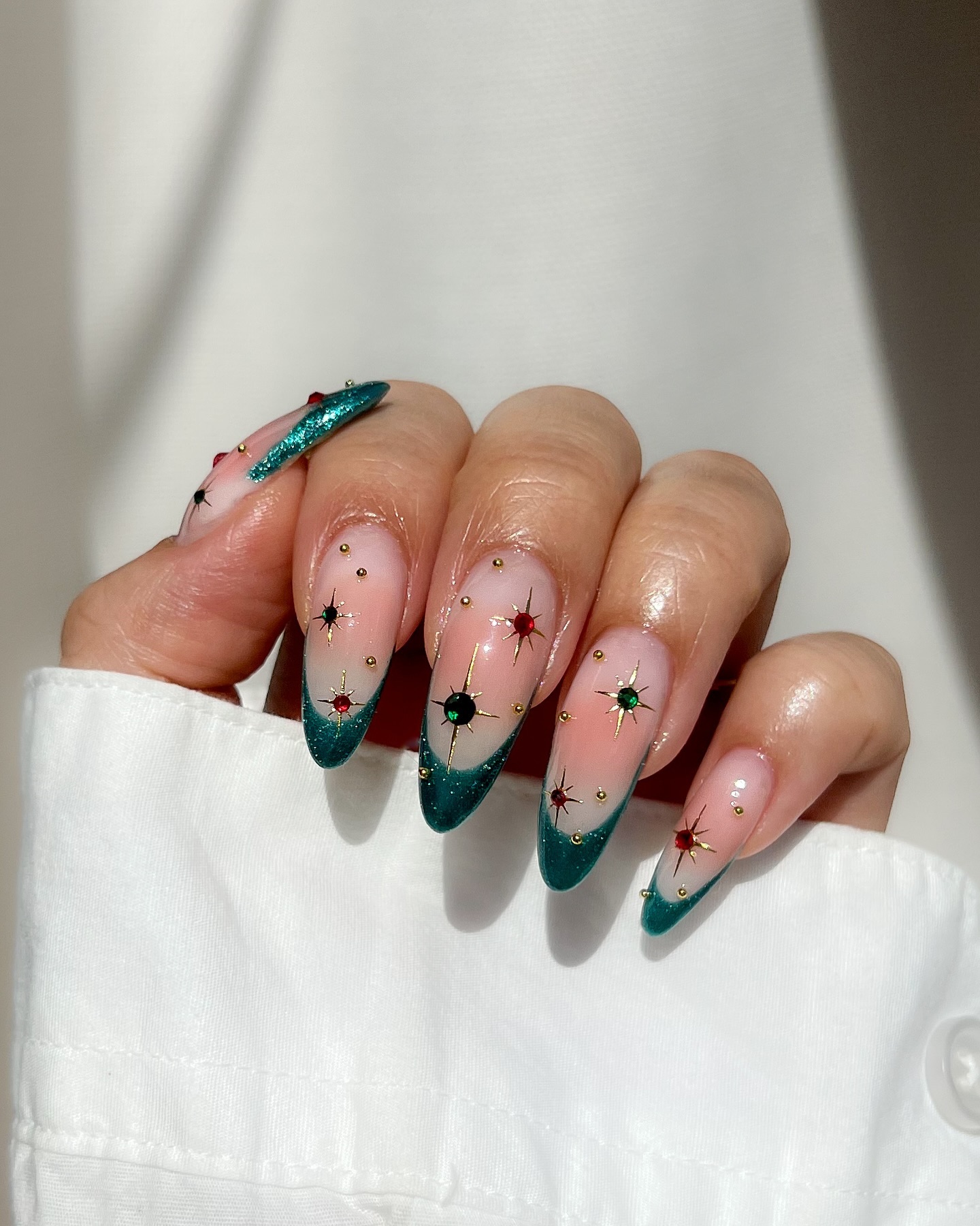 Sparkling Teal French Tip Almond Nails