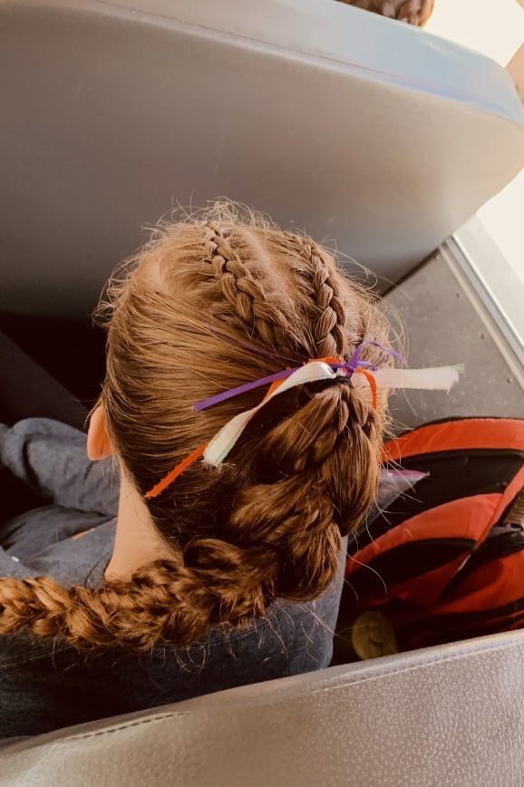 Child's Blonde Braids Into Bun With Ribbons — Sports Hair