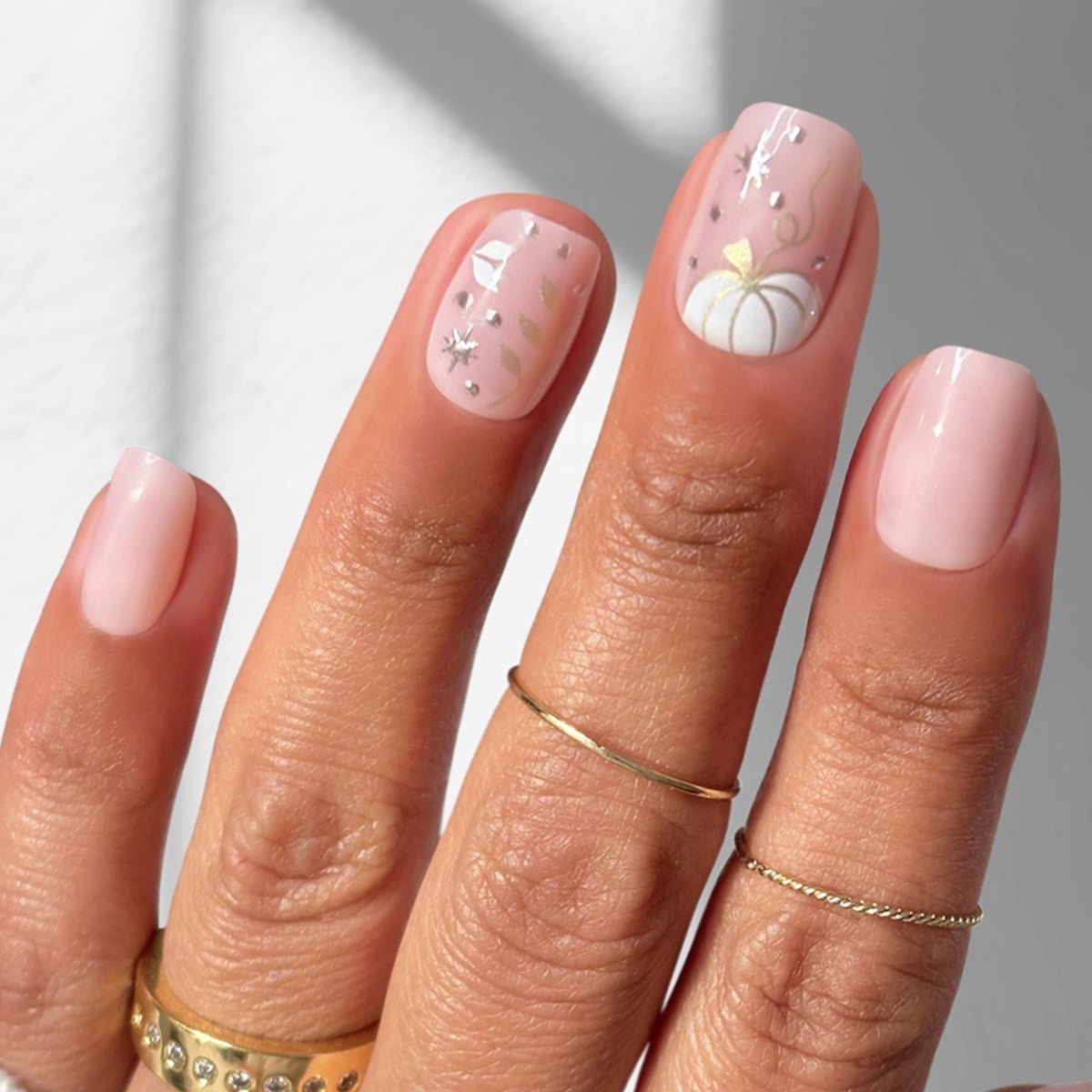 Glossy Nude Short Squoval with Gold Stripe Glossy Nude Short Squoval with Gold Stripe — Squoval Nails