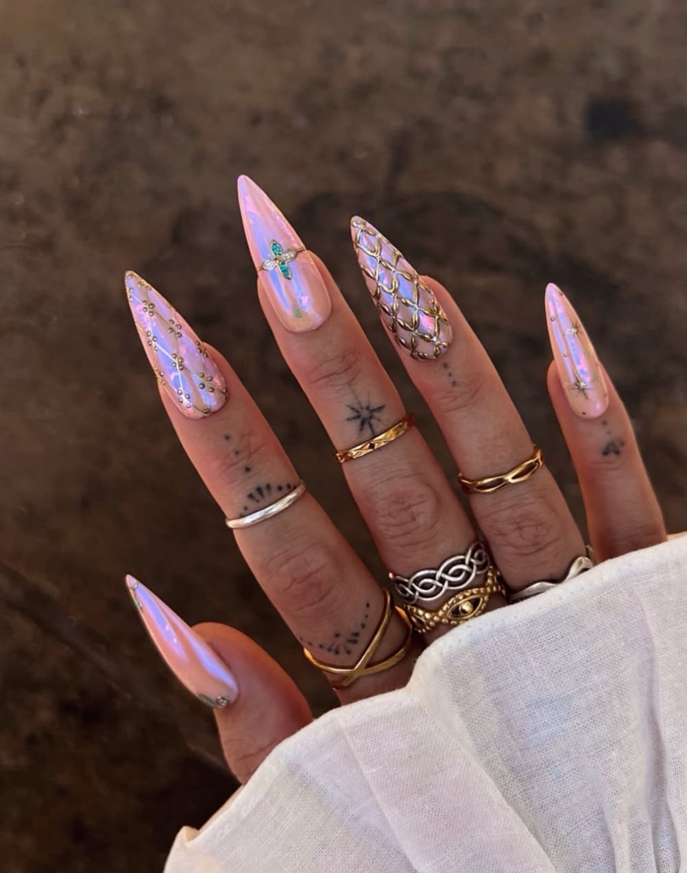 Iridescent Pink Gold Foil Star Stiletto Nails