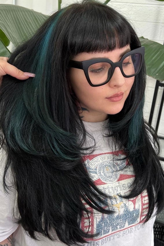 Long Black With Teal Highlights And Blunt Bangs