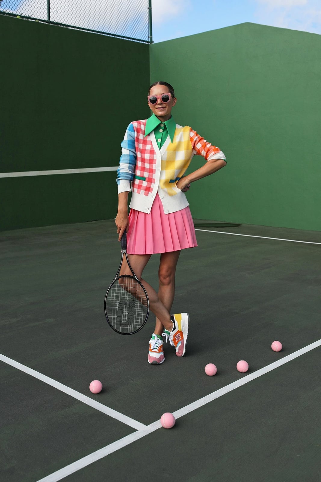 Pink Tennis Skirt and Green Shirt on a Tennis Court Pink Tennis Skirt and Green Shirt on a Tennis Court — Tennis Skirt Outfits