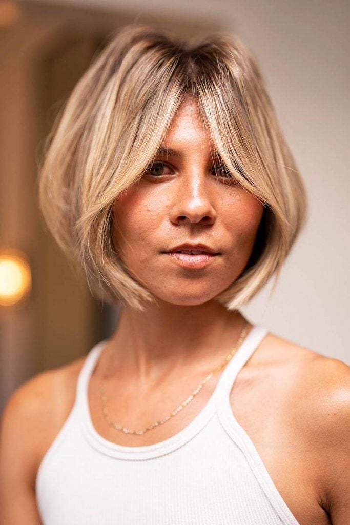 Chin Length Bob With Soft Curtain Bangs Chin Length Bob With Soft Curtain Bangs — Textured Bob