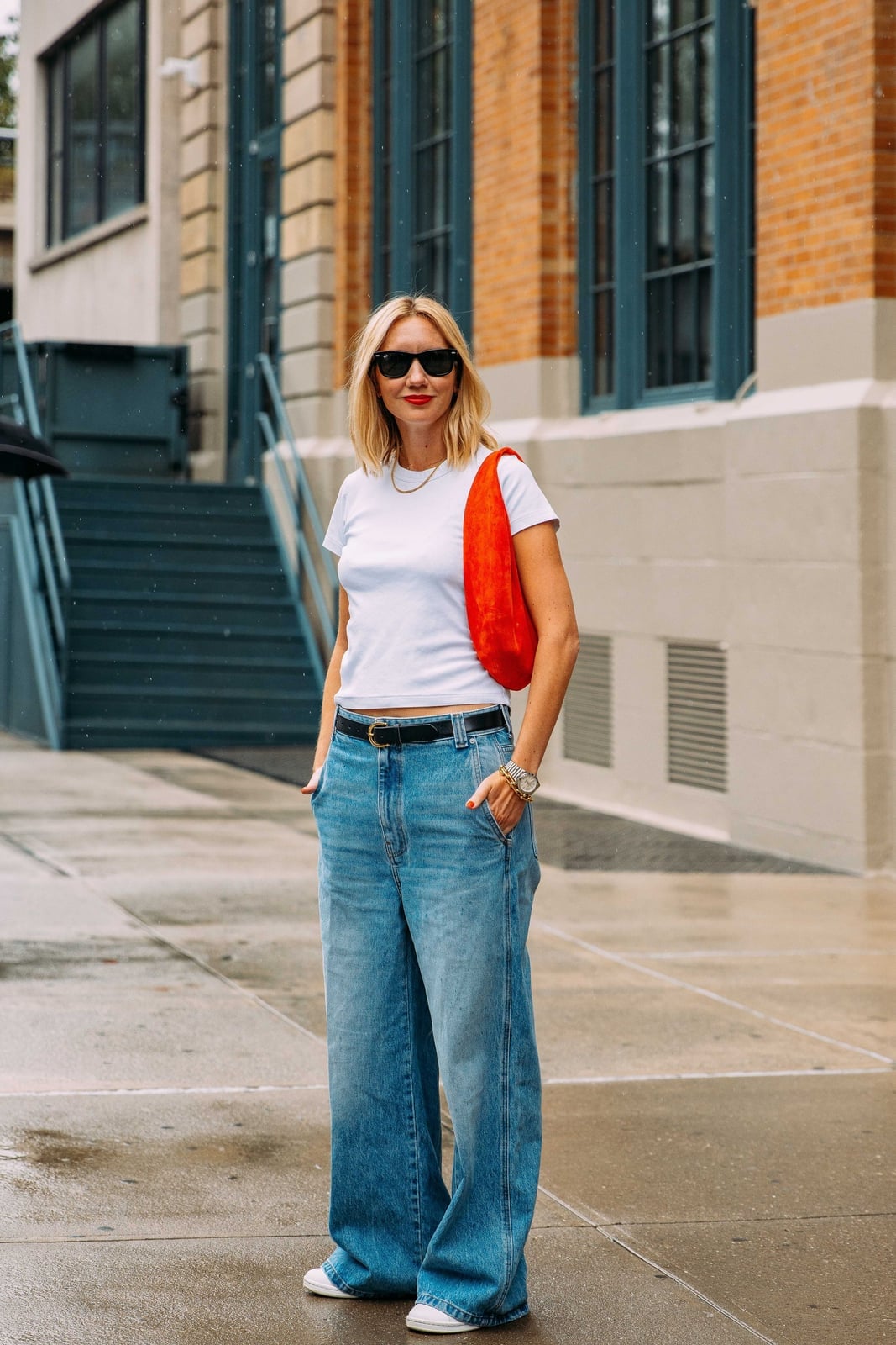 Fitted White T-shirt With High-Waisted Jeans And Orange Bag Fitted White T-shirt With High-Waisted Jeans And Orange Bag — Tshirt Outfit