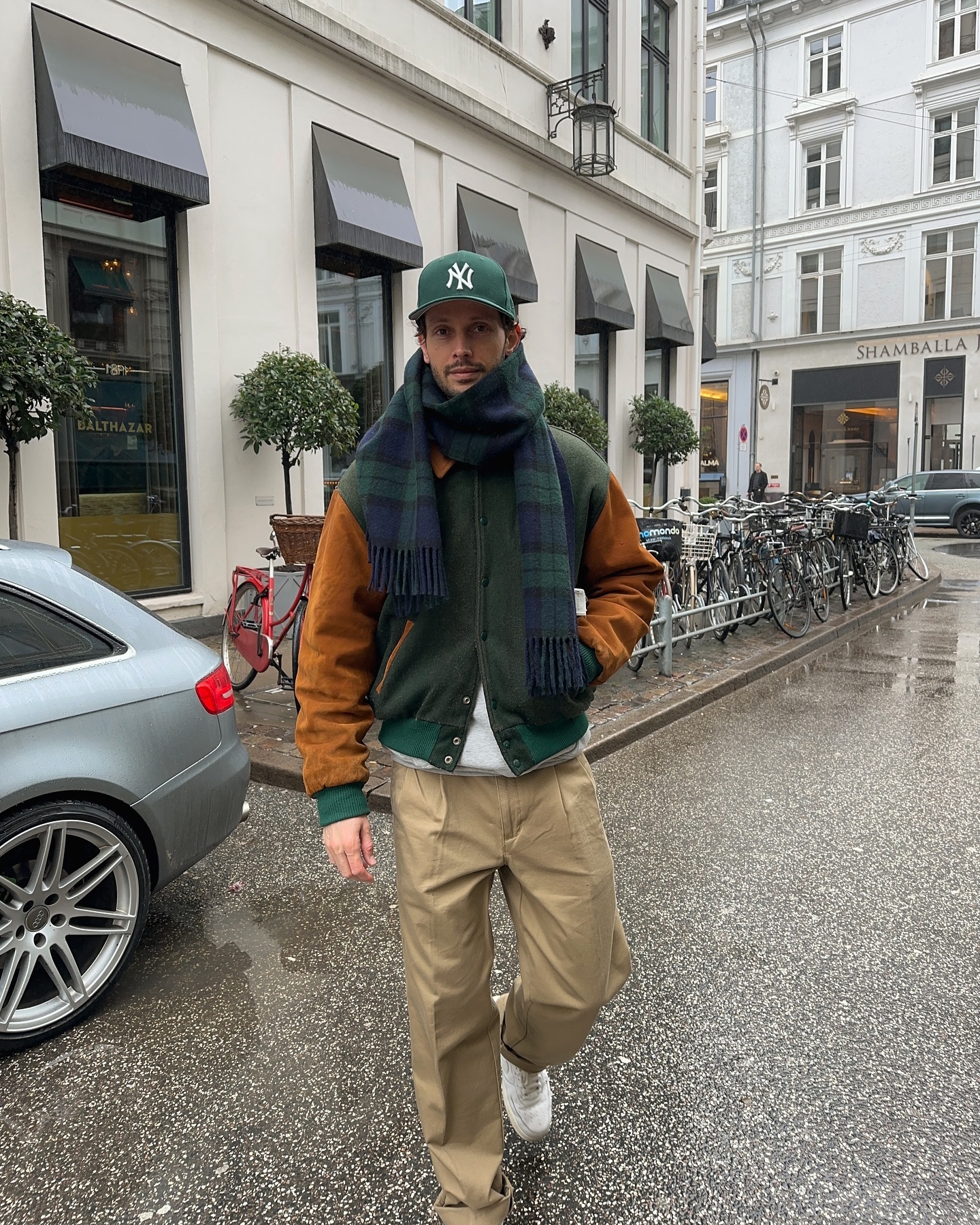 Varsity Bomber With Plaid Scarf And Khakis