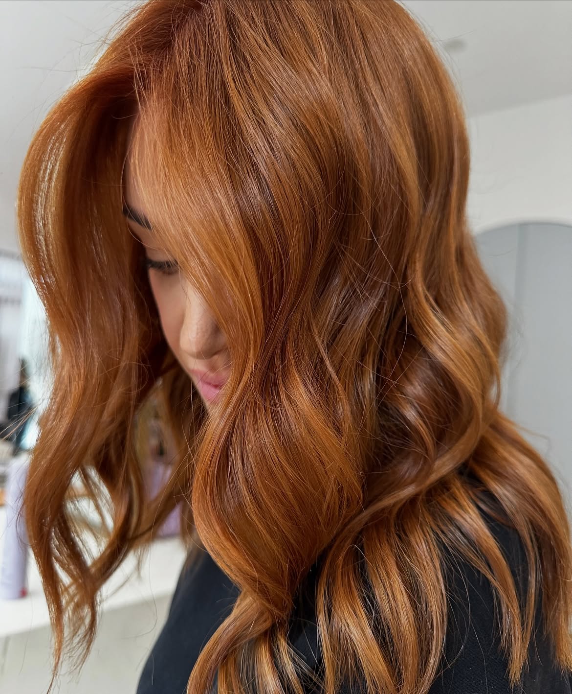 Warm Copper Waves With Face-Framing Layers