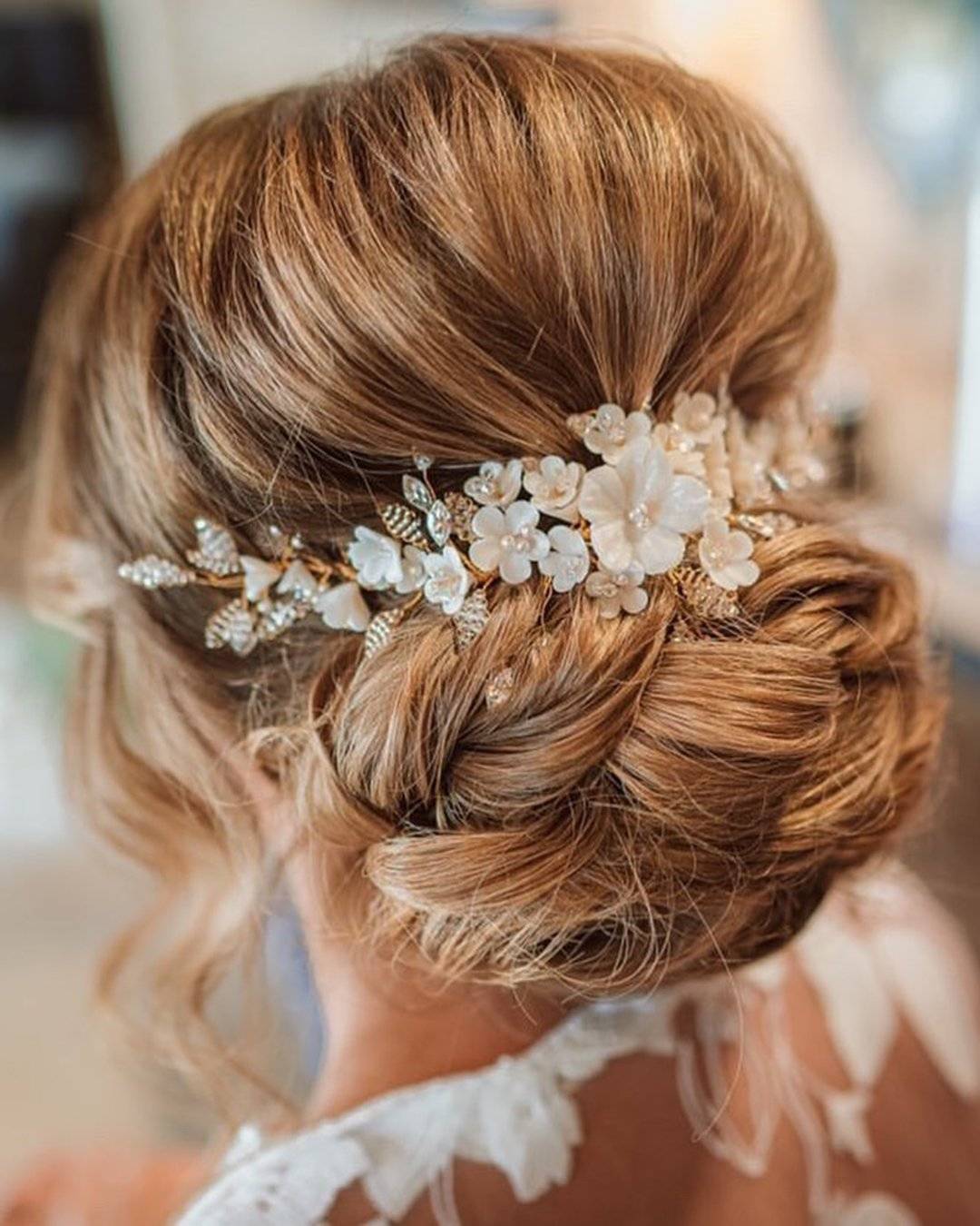 Honey Blonde Low Chignon With Floral Piece Honey Blonde Low Chignon With Floral Piece — Wedding Hairstyles for Long Hair