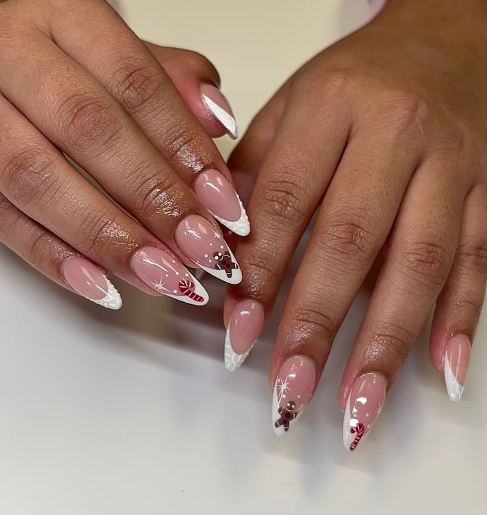 Medium Almond Nails With White French Tips And Christmas Motifs Medium Almond Nails With White French Tips And Christmas Motifs — White Christmas Nails
