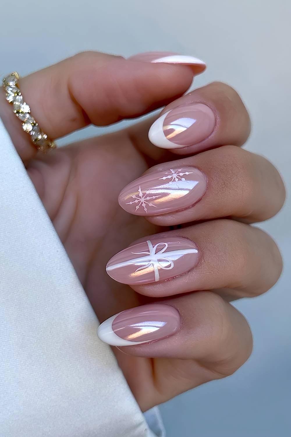 Nude Almond Nails With White Bows And Snowflakes Nude Almond Nails With White Bows And Snowflakes — White Christmas Nails