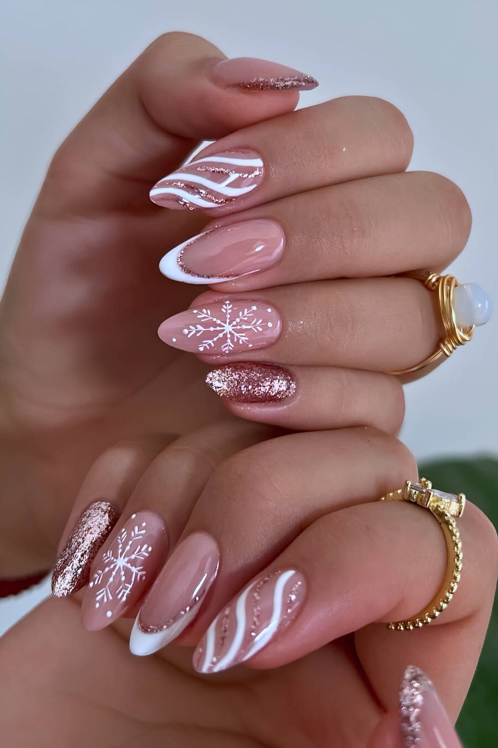 Nude Almond Nails With White French And Rose Gold Snowflakes Nude Almond Nails With White French And Rose Gold Snowflakes — White Christmas Nails