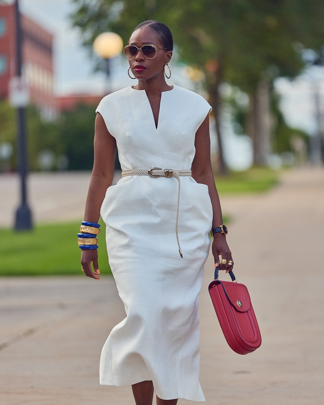 White Sleeveless Sheath Dress With Bold Red Handbag White Sleeveless Sheath Dress With Bold Red Handbag — White Dresses Outfit