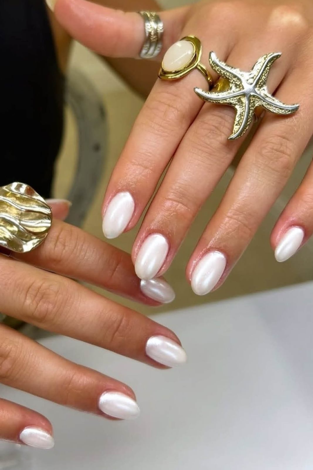 Short Almond Milky White Chrome Shimmer, Close-Up Take Short Almond Milky White Chrome Shimmer, Close-Up Take — White Nails