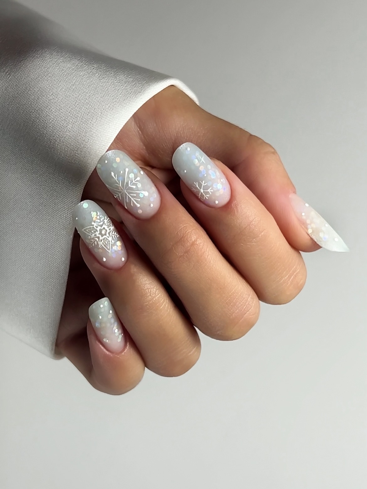 White Snowflake Glitter Ombre Almond Nails