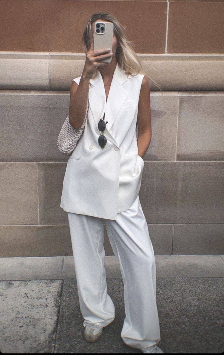 White Sleeveless Blazer with Wide Leg Pants and Smooth Woven Fabric White Sleeveless Blazer with Wide Leg Pants and Smooth Woven Fabric — White Vest Outfit