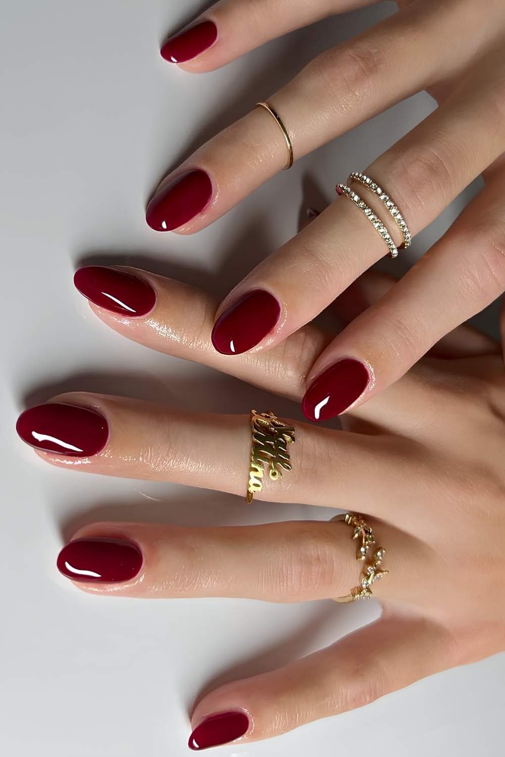 Deep Glossy Wine Red Short Oval Nails, Close-Up Take Deep Glossy Wine Red Short Oval Nails, Close-Up Take — Wine Nails