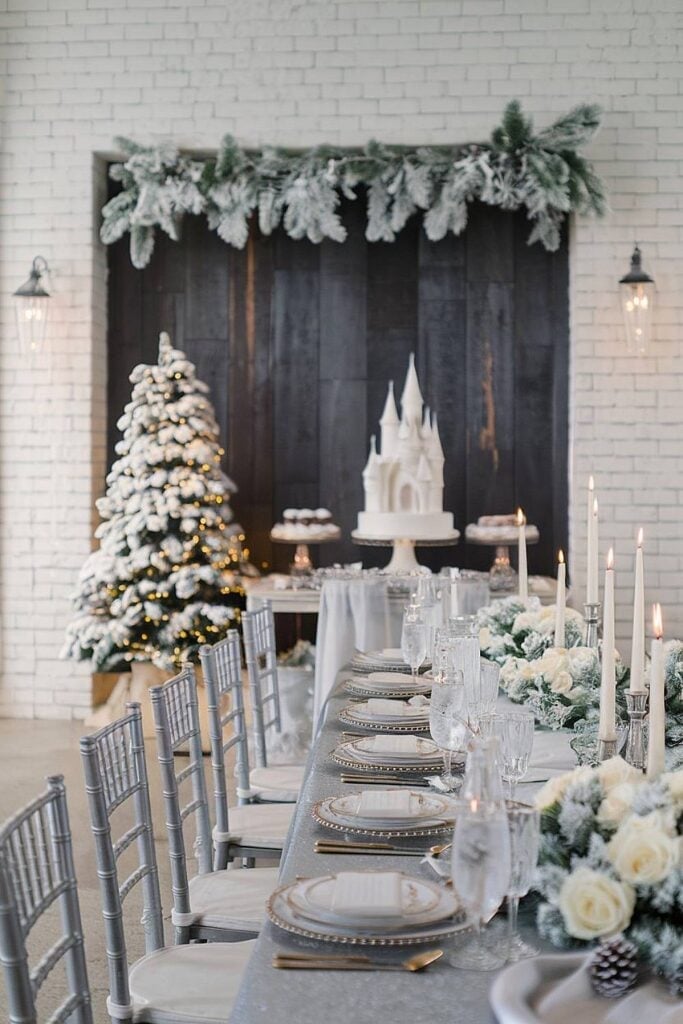 An Elegant Winter Wedding Table Setting with a Castle Cake and Frosted An Elegant Winter Wedding Table Setting with a Castle Cake and Frosted