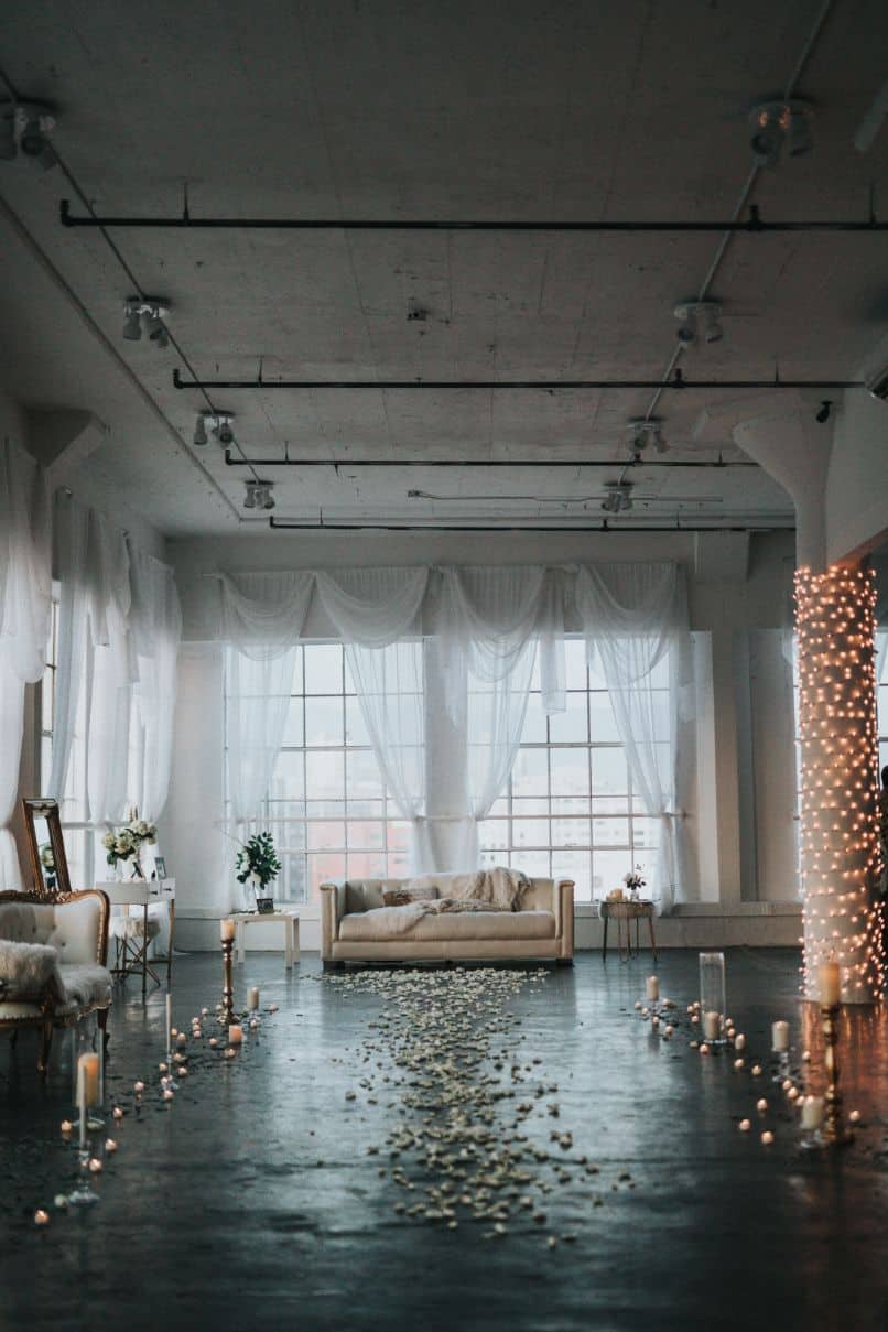 Modern Romantic Reception with a Candlelit Aisle and Sofa Modern Romantic Reception with a Candlelit Aisle and Sofa — Winter Wedding