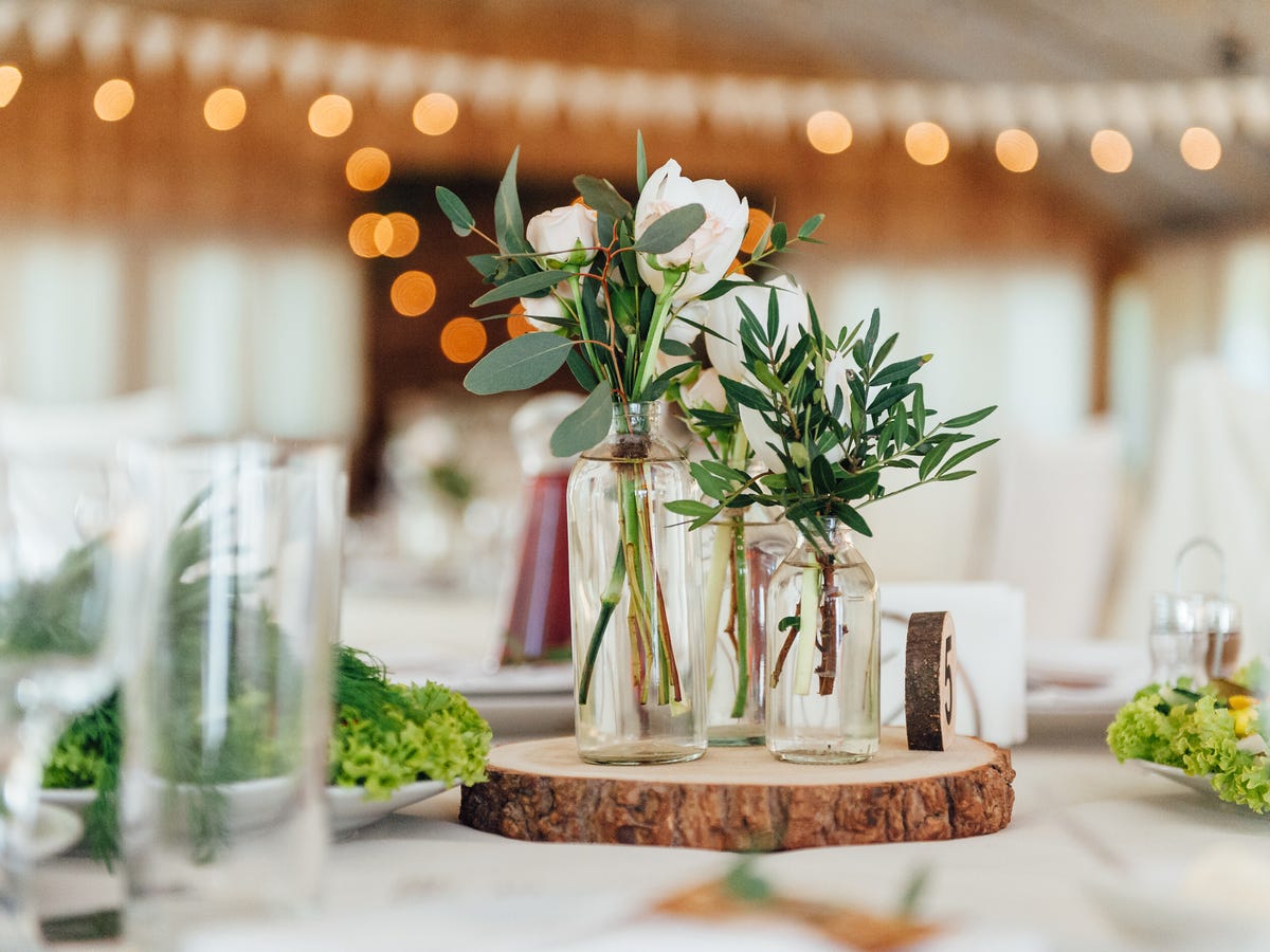 Rustic Reception Table with Bud Vases and Wood Slice Centerpieces Rustic Reception Table with Bud Vases and Wood Slice Centerpieces — Winter Wedding