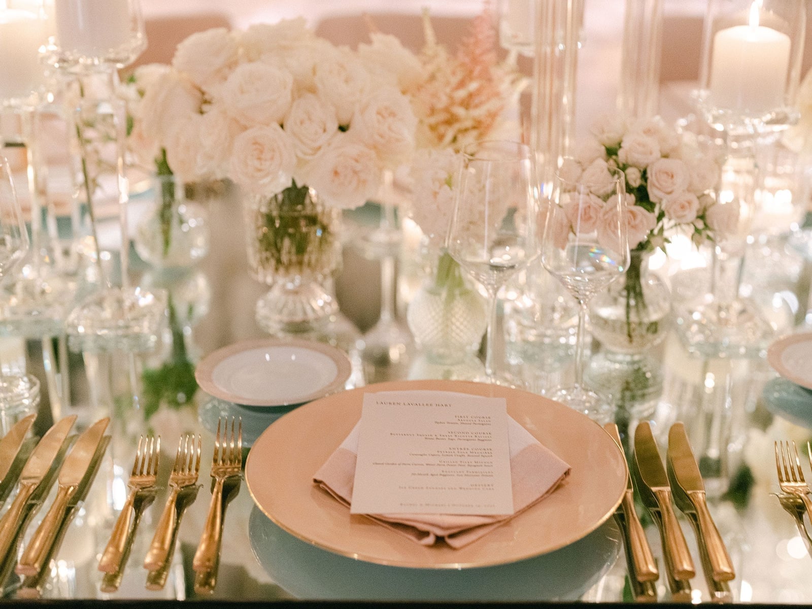 Elegant Table Setting with Gold-Rimmed Plates and White Florals Elegant Table Setting with Gold-Rimmed Plates and White Florals — Winter Wedding