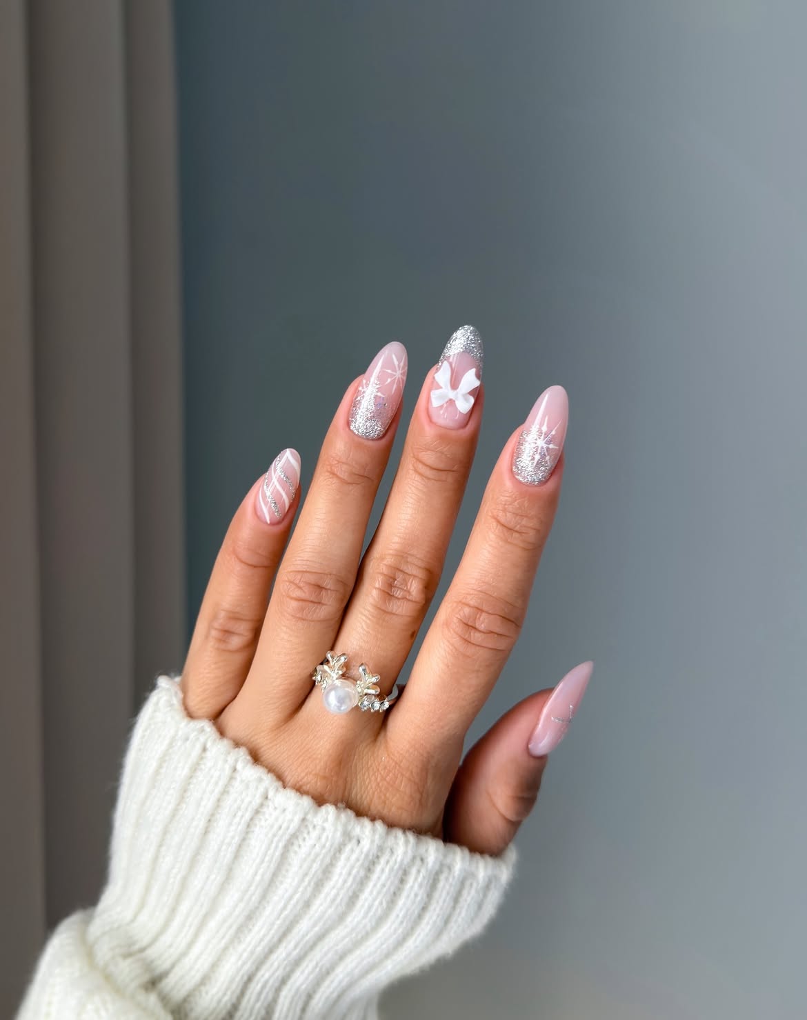 Winter White Bow Snowflake Glitter Almond Nails