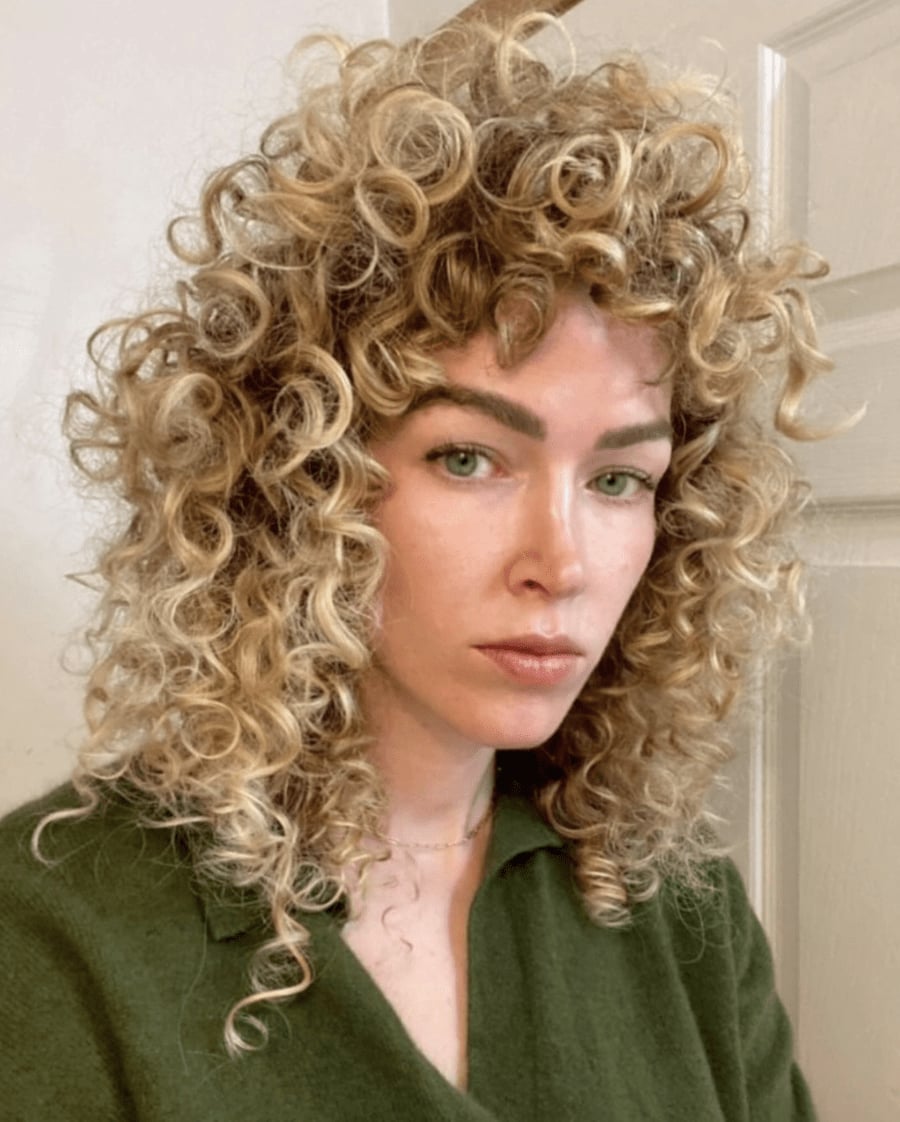 Shoulder Wolf Cut With Subtle Highlights — Wolf Cut Curly Hair