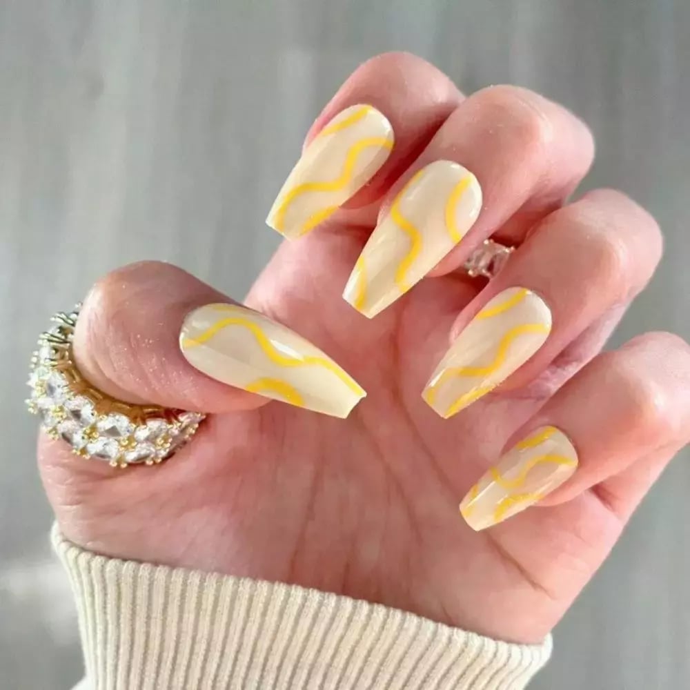 Medium Almond Solid Light Yellow With Floral Accents — Yellow Nails