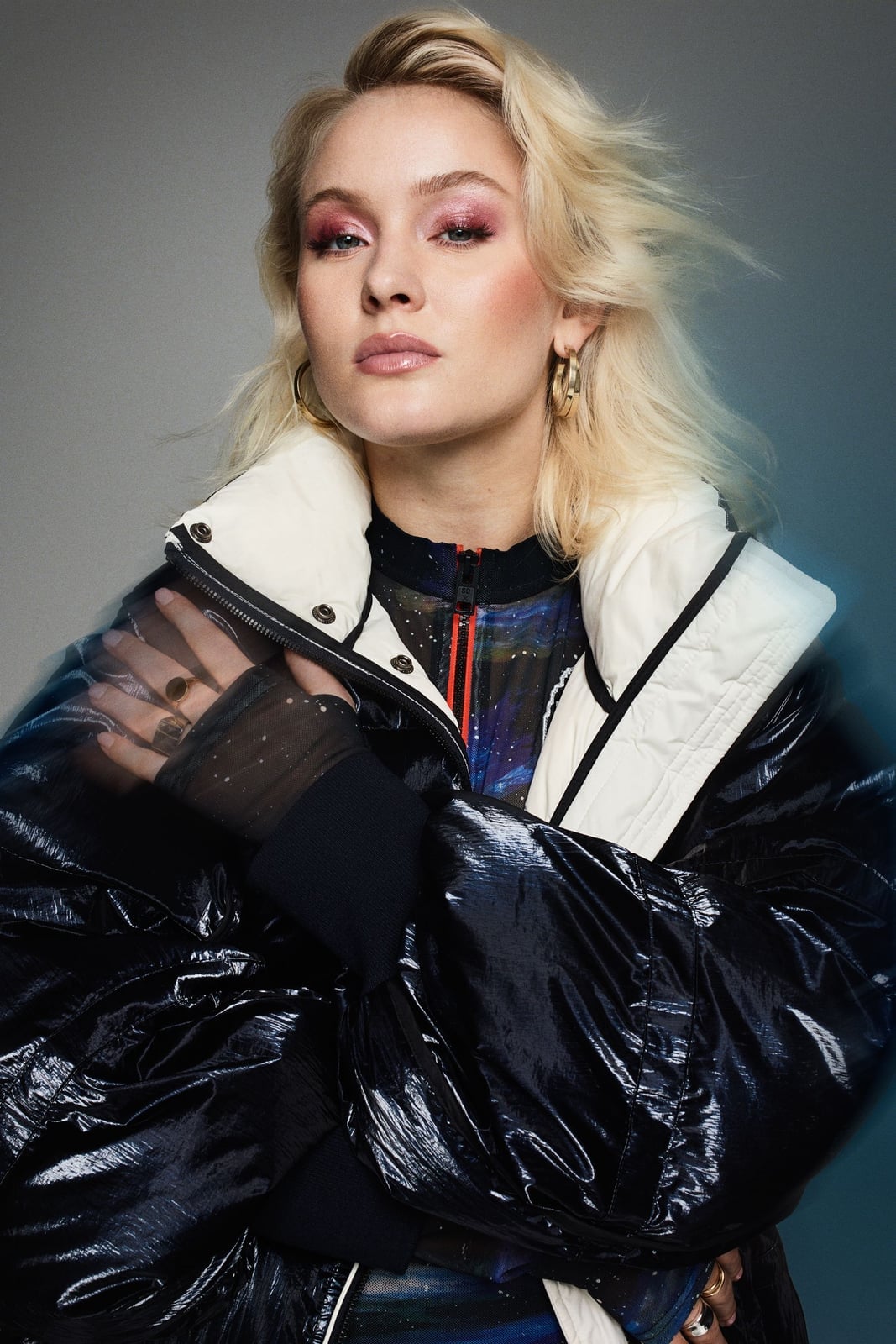Shiny Black Puffer Jacket Over Space Print Top — Zara Larsson Outfits